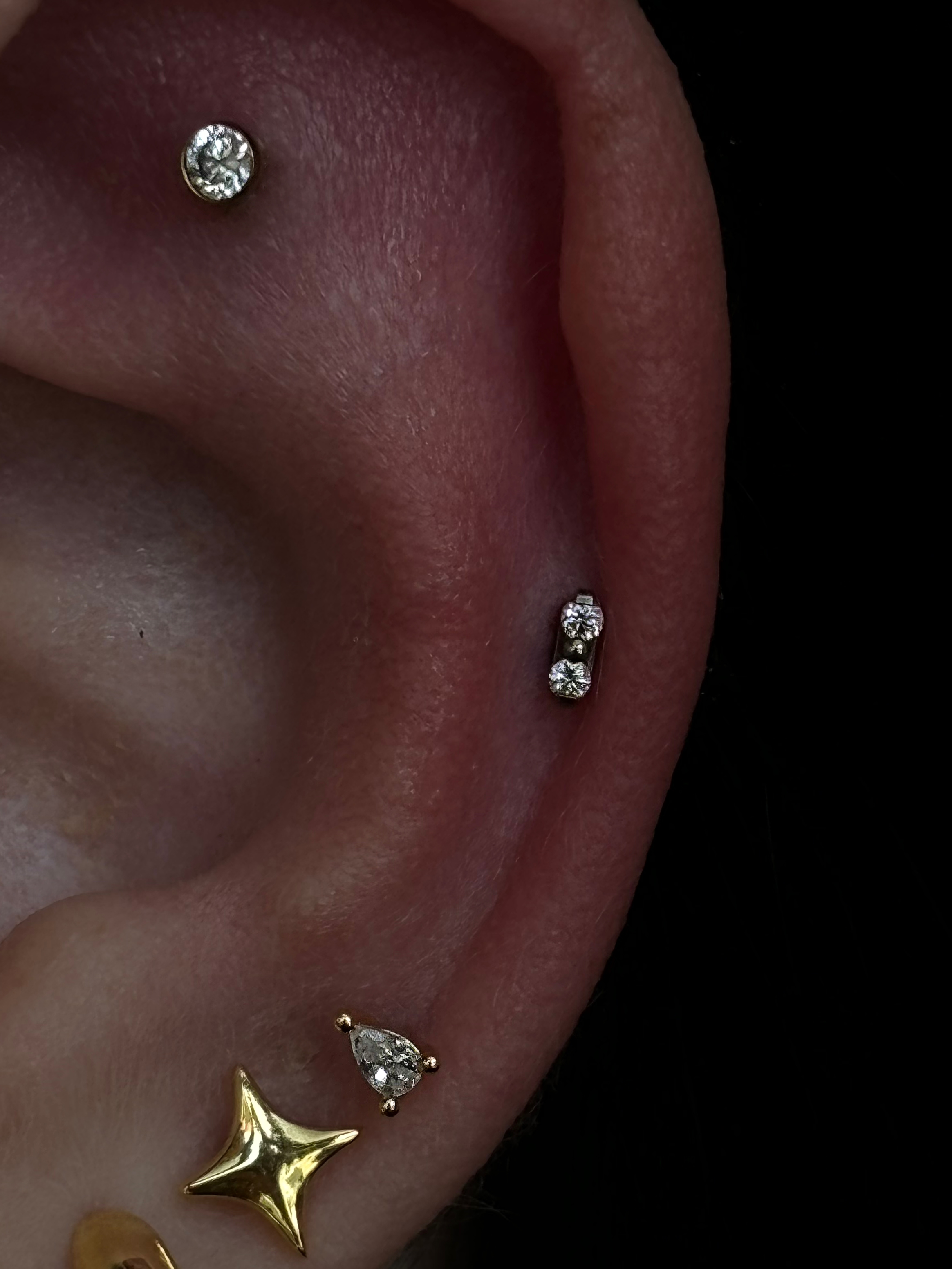 Curated ear with bezel crystal helix, two-stone vertical bar, gold star charm and teardrop crystal lobe