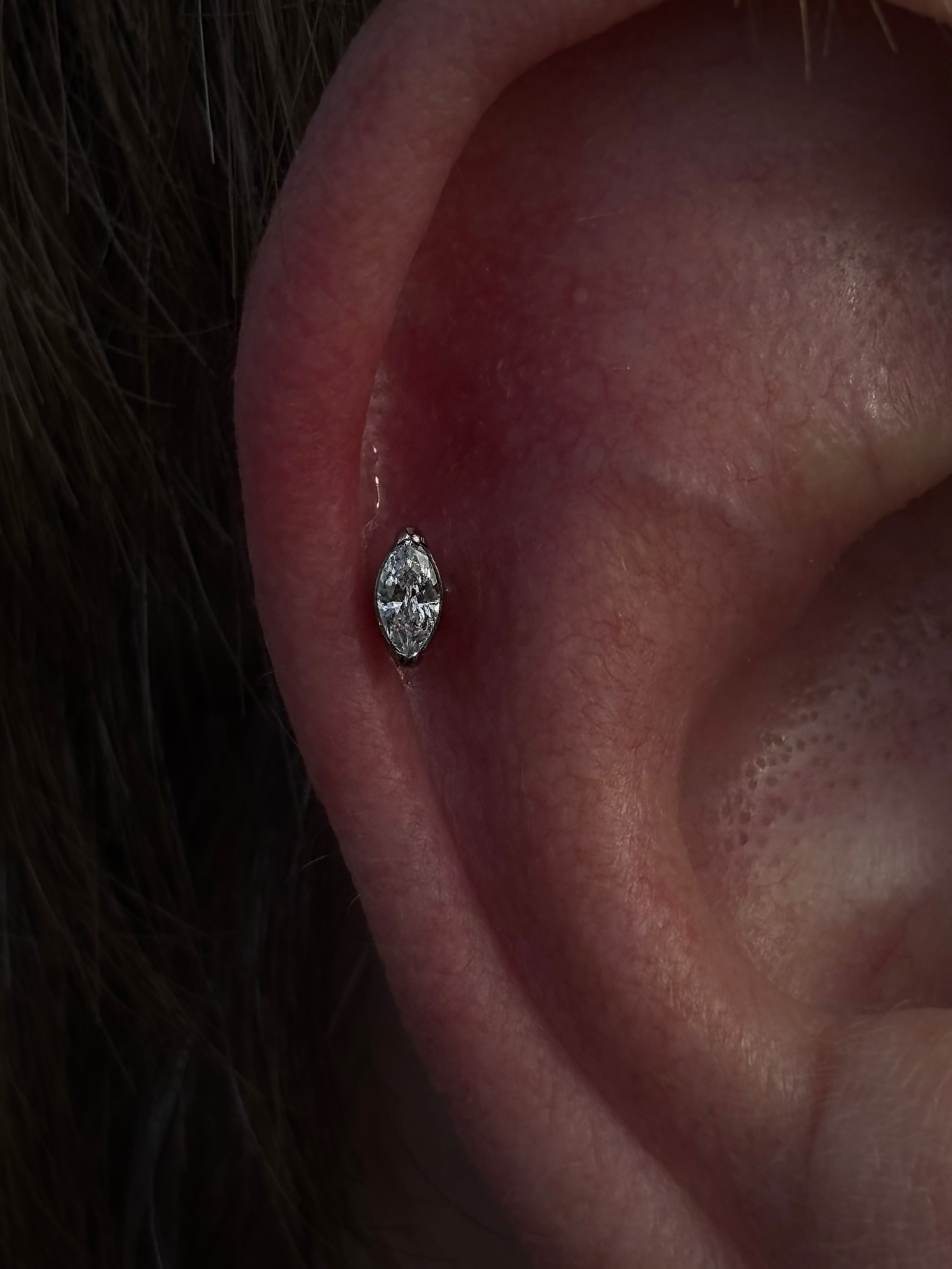 Marquise crystal flat helix piercing close-up