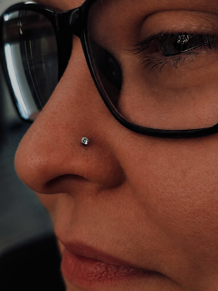 Nostril piercing with a small crystal stud